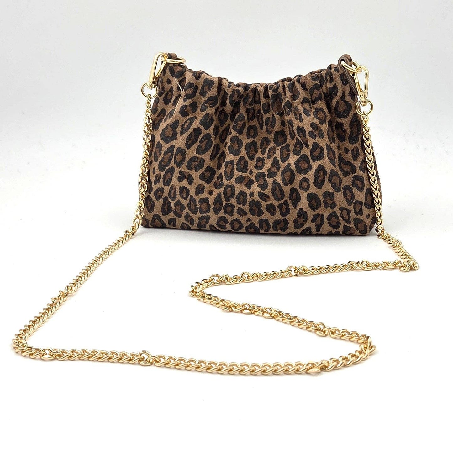 Animal print suede ruched opening clutch bag with chain crossbody