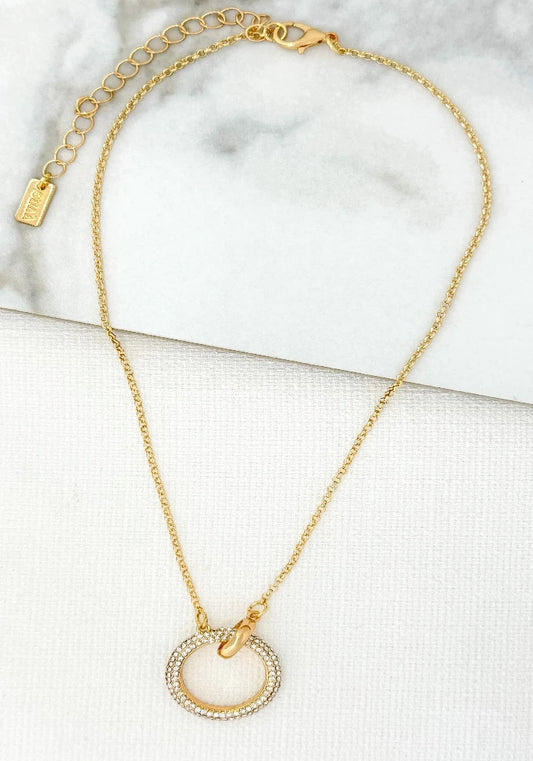 Short gold necklace with crystal circle pendant
